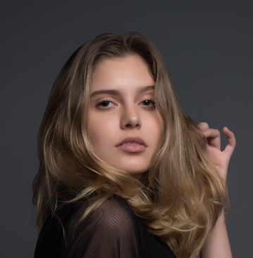 Woman posing in dark outfit