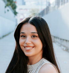 Woman with long dark hair smiling